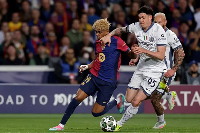Lamine Yamal of FC Barcelona, Alessandro Bastoni of Internazionale battle for the ball