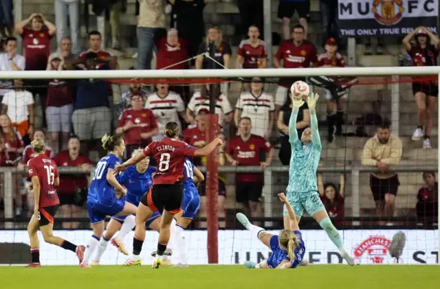 Hampton tips Clinton's shot over the bar