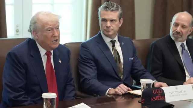 Trump with Pete Hegseth and Howard Lutnick sitting to his left