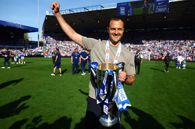 Birmingham boss Chris Davies celebrates with the League One trophy