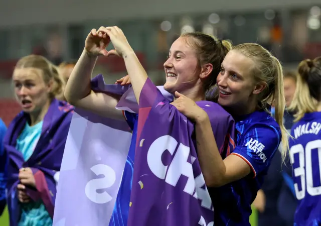 Chelsea's Wieke Kaptein and Agnes Beever-Jones celebrate after winning the Women's Super League