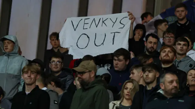 Blackburn fans hold up a Venkys out banner