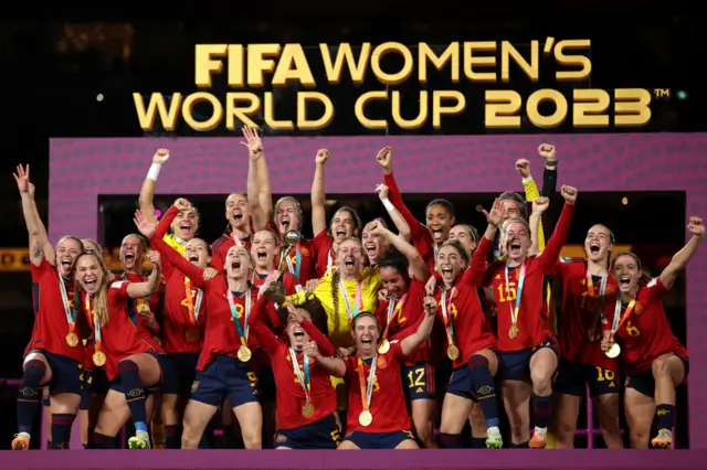 Ivana Andres of Spain and teammates celebrate with the FIFA Women's World Cup Trophy
