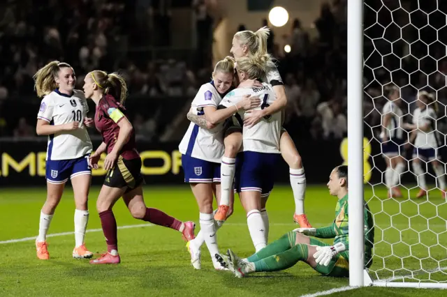 England's Millie Bright (centre) celebrates with team-mates after scoring their side's second goal