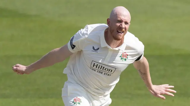 Luke Wells bowling for Lancashire