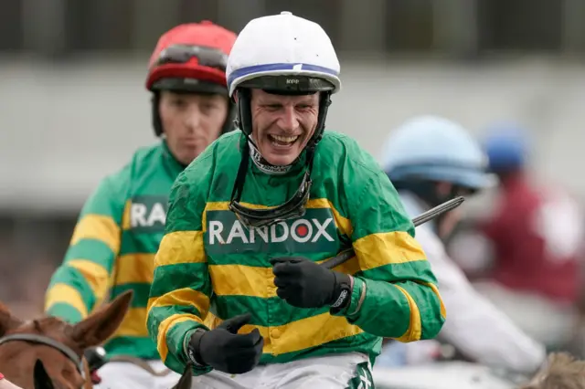 Paul Townend celebrates winning the 2024 Grand National on I Am Maximus