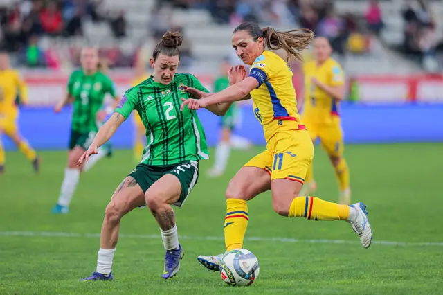 Florentina Olar-Spanu (R) of Romania competes for the ball with Rebecca McKenna (L) of Northern Ireland