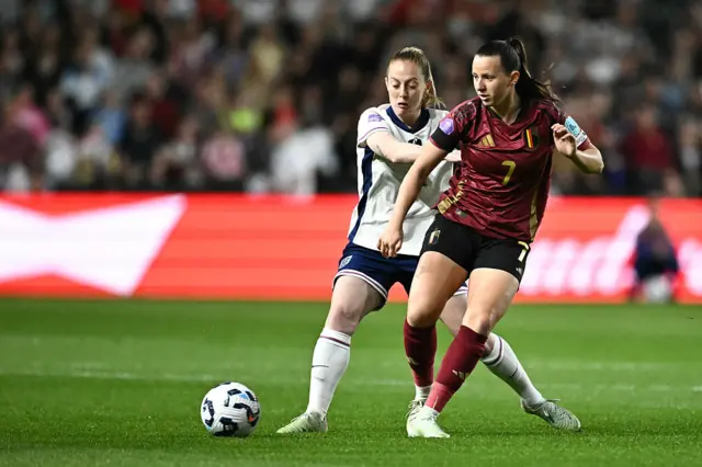 England's midfielder #04 Keira Walsh (L) fights for the ball Belgium's forward #07 Hannah Eurlings during the UEFA Women's Nations League