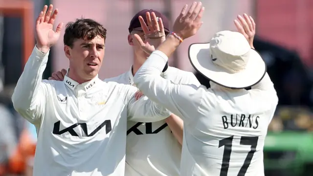 Surrey's Dan Lawrence celebrates taking a wicket against Essex