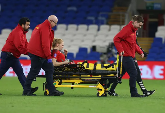 Ceri Holland stretchered off pitch