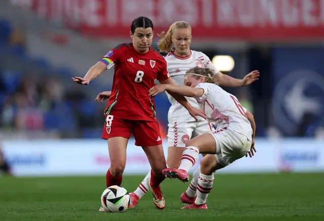 Angharad James fights for possession