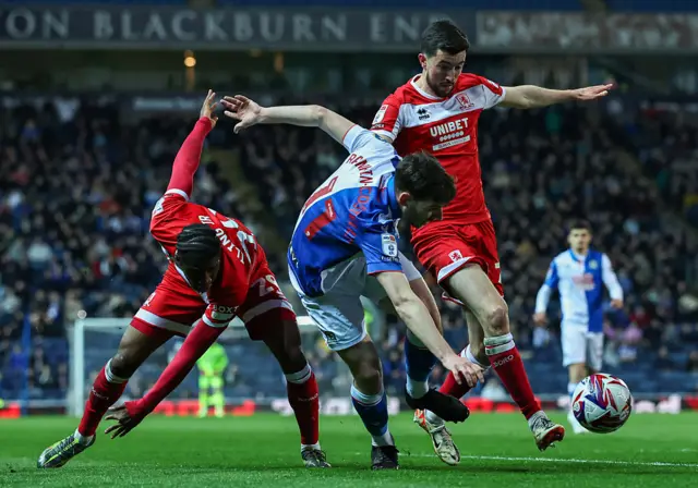 Blackburn Rovers' Joseph Rankin-Costello holds off the challenge from Middlesbrough's Finn Azaz and Samuel Iling-Junior