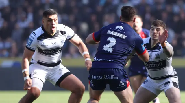 Hull KR's Tom Davies takes on Hull FC