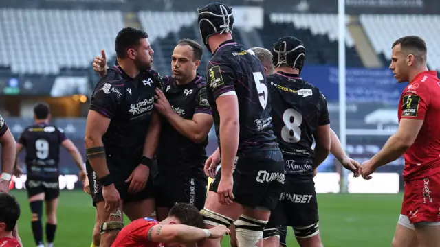 Ospreys players congratulate Rhys Davies