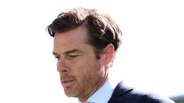 Burnley boss Scott Parker looks at the ground
