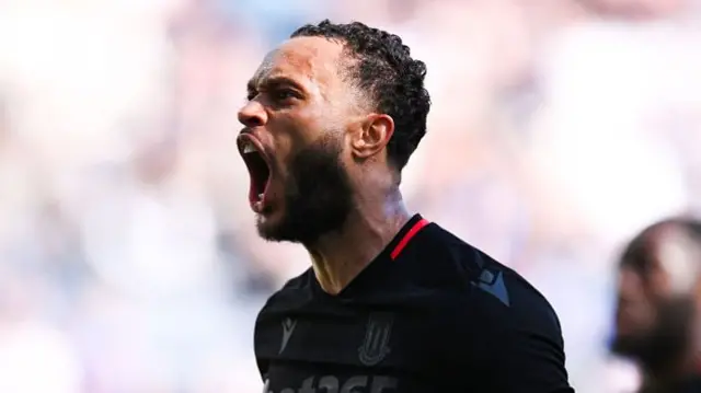 Stoke City's Lewis Baker celebrating with mouth open after scoring