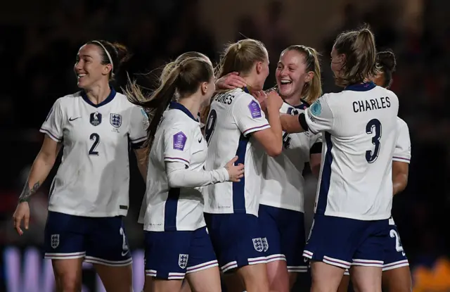 Keira Walsh of England celebrates with her teammates after scoring her team's fifth goal