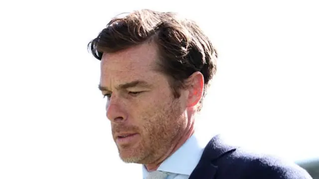 Burnley boss Scott Parker looks at the ground