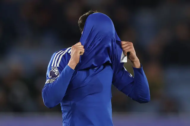 Facundo Buonanotte with his head in his shirt