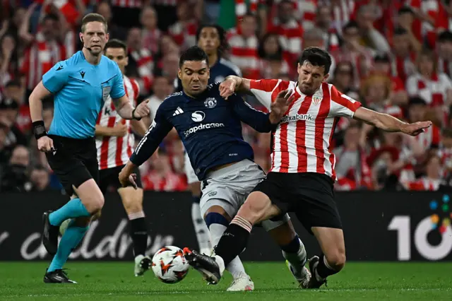 Manchester United's Brazilian midfielder #18 Casemiro (L) is challenged by Athletic Bilbao's Spanish defender #03 Dani Vivian during the UEFA Europa League semi final first leg football match between Athletic Club Bilbao and Manchester United at the San Mames stadium in Bilbao,