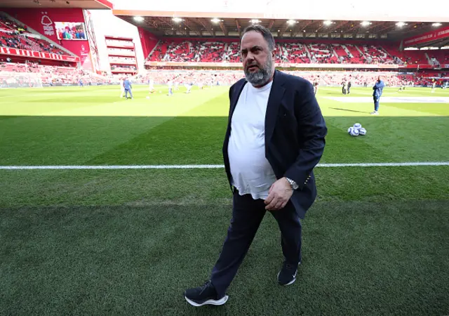 Evangelos Marinakis looks on