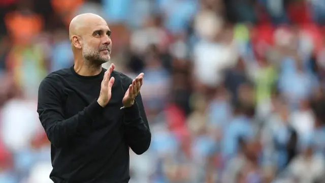 Manchester City manager Pep Guardiola applauds the fans at the end of the match during the Emirates FA Cup Semi Final match between Nottingham Forest and Manchester City at Wembley Stadium on April 27, 2025.