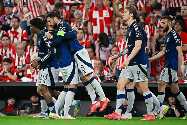 Manchester United's Portuguese midfielder #08 Bruno Fernandes (2L) celebrates with teammates after scoring their second goal during the UEFA Europa League semi final first leg football match between Athletic Club Bilbao and Manchester United at the San Mames stadium in Bilbao, on May 1, 2025.