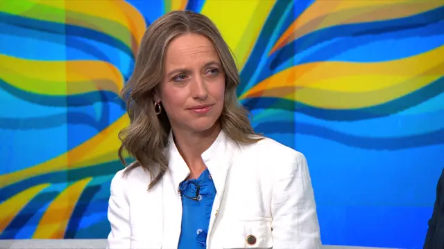 Helen Whately, wearing a blue shirt under a white jacket, speaks to Newsnight