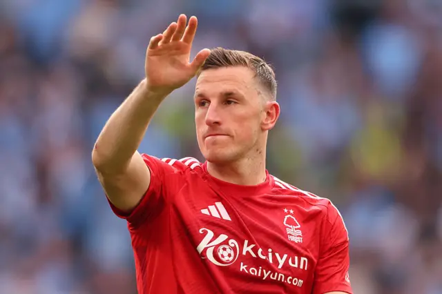 Chris Wood with his hand in the air