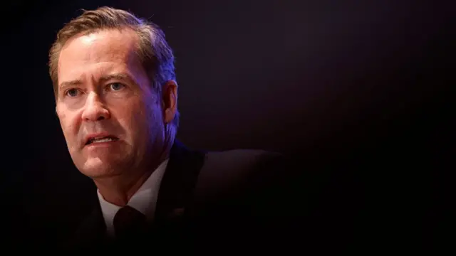 Mike Waltz in a dark suit.