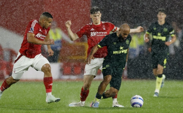 Brentford's Bryan Mbeumo in action with Nottingham Forest's Murillo and Nottingham Forest's Ryan Yates