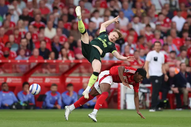 Keane Lewis-Potter of Brentford collides with Anthony Elanga
