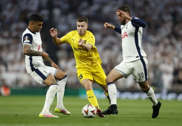 Bodo/Glimt's Fredrik Andre Bjorkan in action with Tottenham Hotspur's Cristian Romero and Rodrigo Bentancur