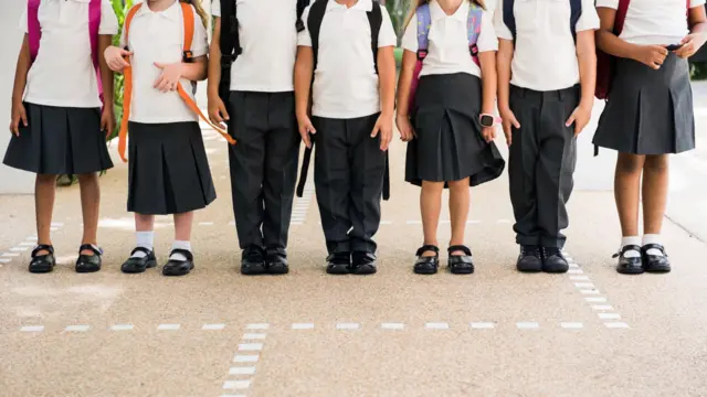 Anonymous children wearing school uniforms