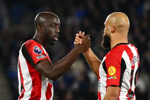 Yoane Wissa and Bryan Mbeumo shaking hands