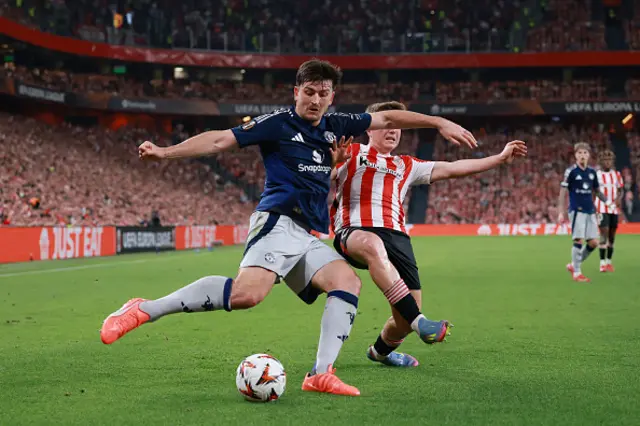 Harry Maguire of Manchester United is challenged by Daniel Vivian