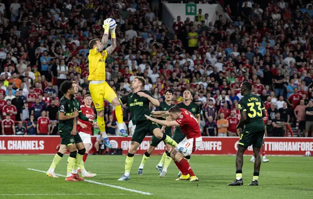 Brentford's goalkeeper Mark Flekken saves under pressure