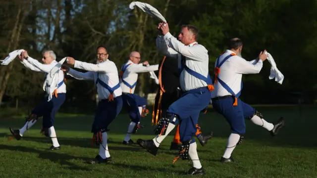 A group of Morris dancers perform