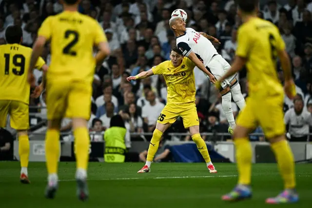 Tottenham Hotspur's Brazilian striker #09 Richarlison (R) heads the ball over Bodoe/Glimt's Norwegian defender #25 Isak Maatta