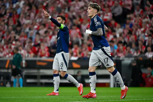 Manchester United's Argentinian midfielder #17 Alejandro Garnacho (R) reacts after his goal was disallowed for offsides during the UEFA Europa League semi final first leg football match between Athletic Club Bilbao and Manchester United at the San Mames stadium in Bilbao,