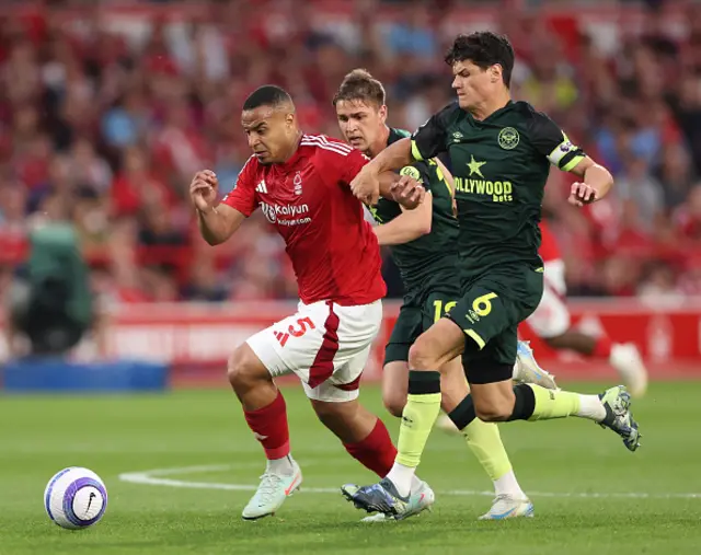 Murillo of Nottingham Forest battles for possession with Christian Norgaard