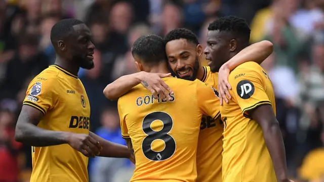 Matheus Cunha of Wolverhampton Wanderers celebrates scoring his team's first goal with teammates Joao Gomes and Marshall Munetsi during the Premier League match between Wolverhampton Wanderers FC and Leicester City FC at Molineux on April 26, 2025