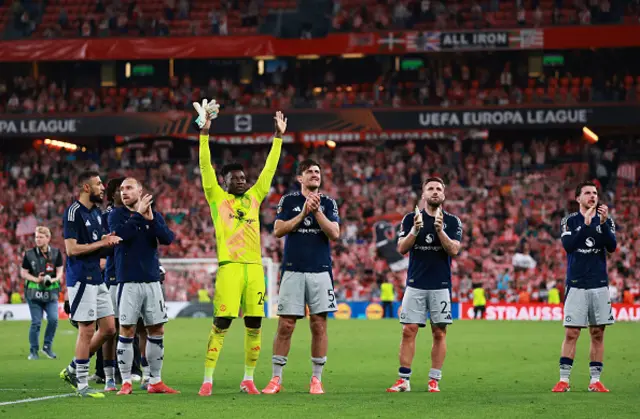 Andre Onana, Harry Maguire, Luke Shaw and Mason Mount of Manchester United acknowledge the fans