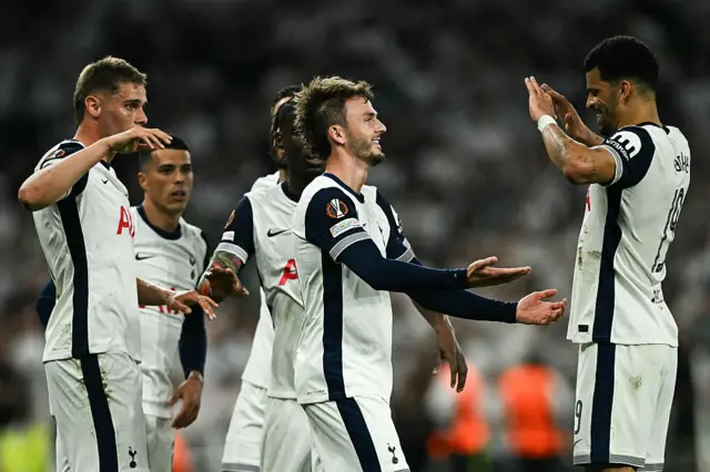 Tottenham Hotspur's English midfielder #10 James Maddison (C) celebrates with teammates after scoring his team second goal during the UEFA Europa League Semi-Final First Leg football match between Tottenham Hotspur and Bodoe/Glimt at the Tottenham Hotspur Stadium in London, on May 1, 2025.