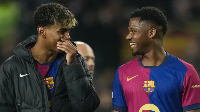 Lamine Yamal speaks to Barcelona team-mate Ansu Fati