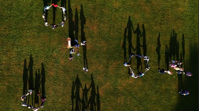 A birds eye view of people dancing in circles
