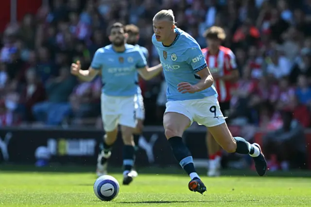 Erling Haaland runs with the ball