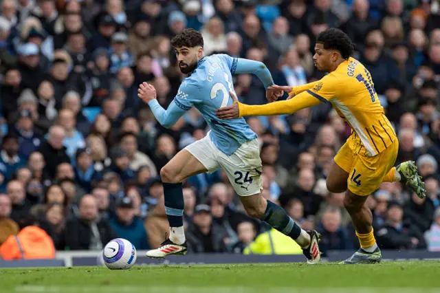 Josko Gvardiol of Manchester City F.C. is tackled by Georginio Rutter