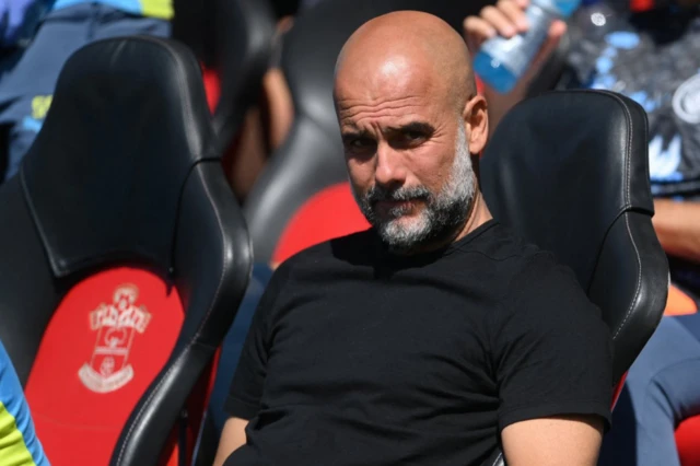 Manchester City manager Pep Guardiola looks on