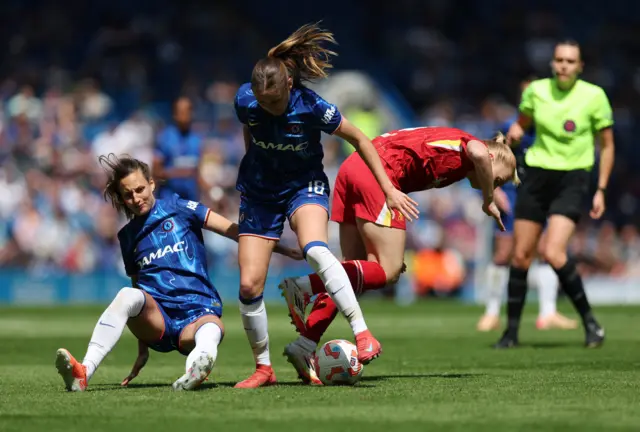 Chelsea's Nathalie Bjorn and Wieke Kaptein in action with Liverpool's Ceri Holland